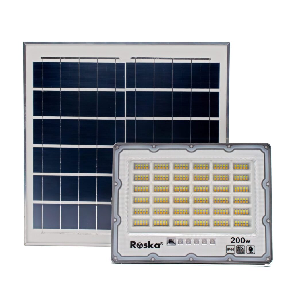 Roska R-200SFL-N 200W solar LED flood light with 3-CCT mixed warm+cool LEDs (6x6 grid visible), Roska label 200W IP66, OFF/ON SENSOR and TMG timer mode buttons on flood face, separate polycrystalline solar panel