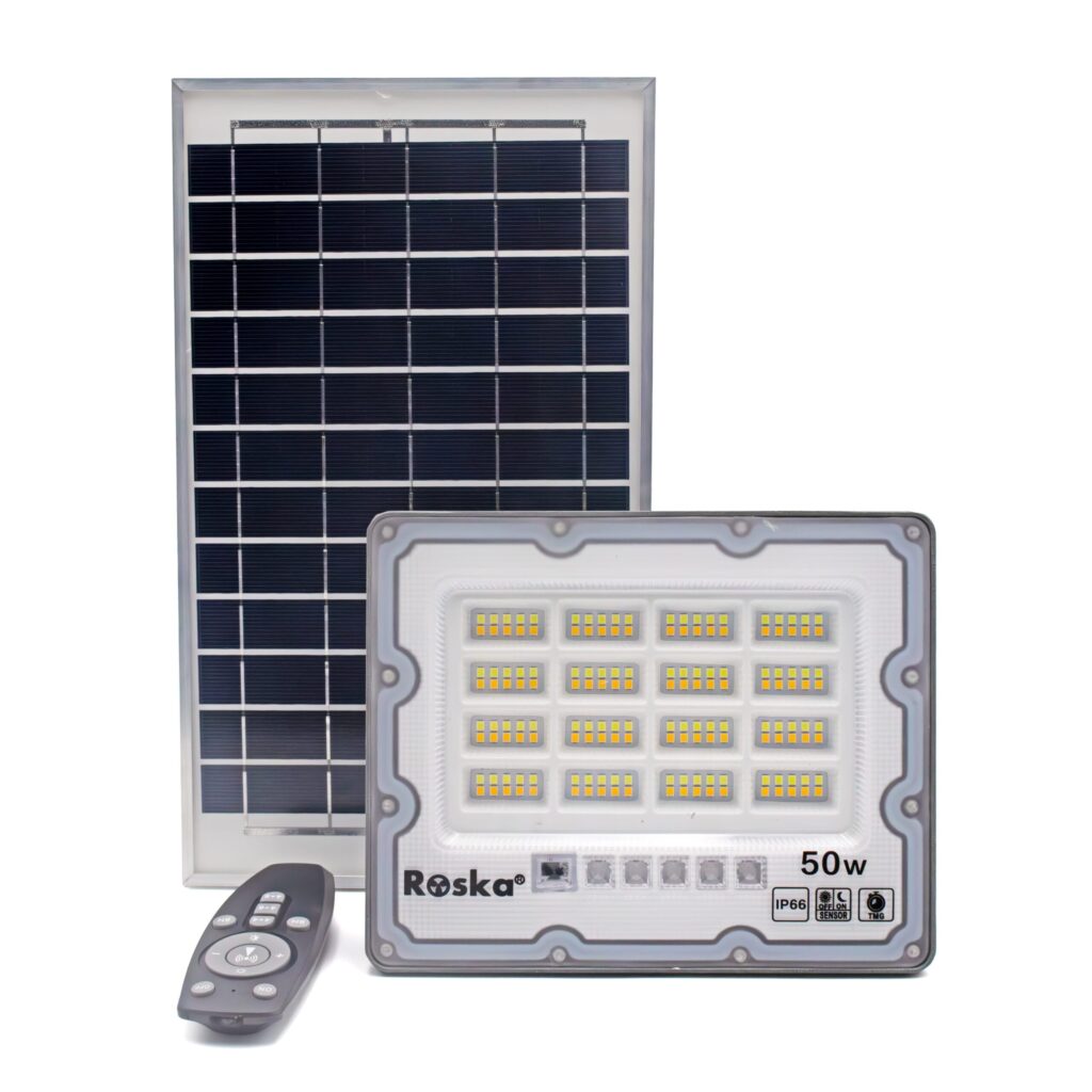 Roska R-50SFL-N 50W solar LED flood light with 3-CCT mixed warm+cool LEDs (4x4 grid visible), Roska label 50W IP66, advanced remote with B+/B-/4H/6H/+/-/ON/OFF buttons, separate polycrystalline solar panel, OFF/ON SENSOR and TMG timer mode buttons on flood face